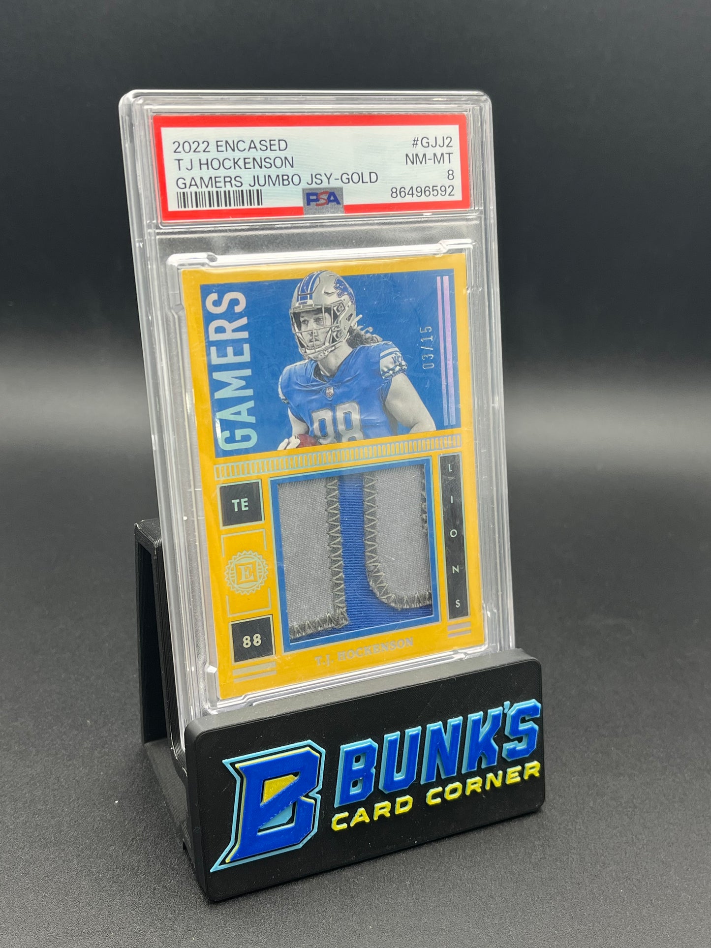 2022 TJ Hockenson Gamers Jumbo JSY-Gold PSA 8 3/15