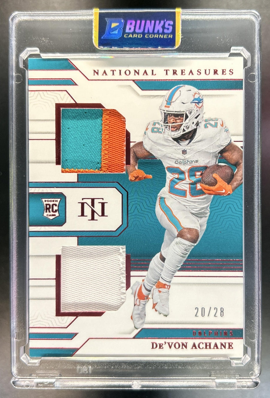 De'Von Achane 2023 Panini National Treasures #RDM-DAE Rookie Dual Materials Jersey Number Red 20/28 MEM Dolphins